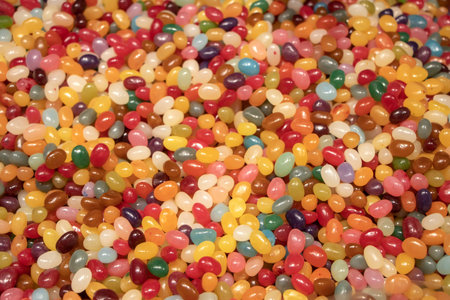 Multicolored jelly stick candies textured background.