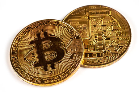 Gold bitcoin isolated on white background.