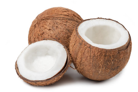 Coconuts on a white background. half coconut
