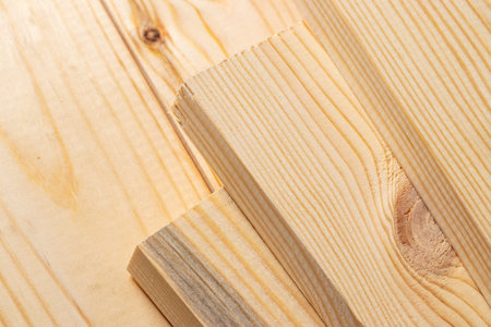 Stacks of pine wood planks. Natural rough wooden boards boards, lumber, industrial wood, timber.