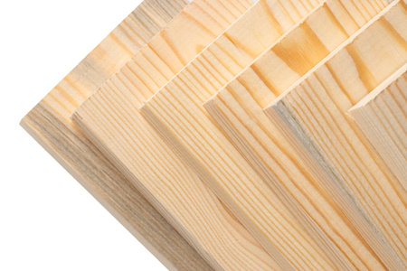 Wooden boards on white in a woodworking industry. stacks with pine lumber. folded edge board. timber...