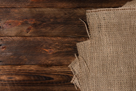 Burlap texture on wooden table background.の写真素材