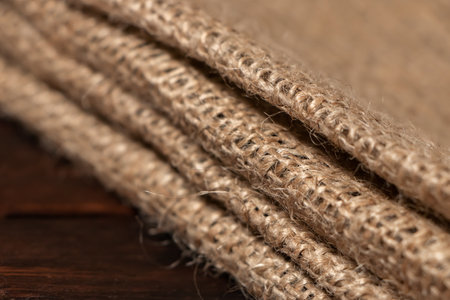Wood table with old burlap tablecloth texture.の写真素材