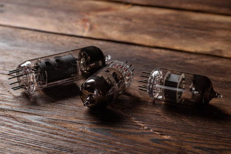 Vacuum electronic radio lamps tube on wooden background.の写真素材