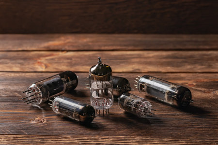 Vacuum electronic radio lamps tube on wooden background.の写真素材