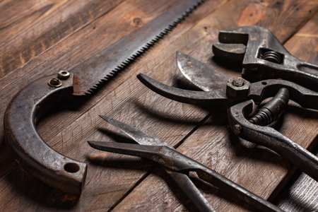 Dirty set of hand tools on a wooden boards.の写真素材