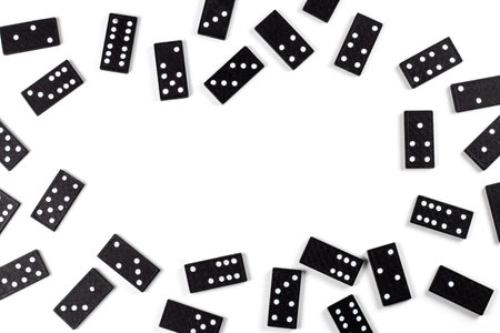 Playing dominoes on a white table. Domino effect.の写真素材