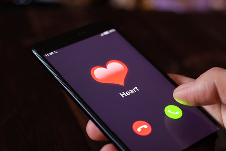 The human heart disease. Call from the heart. Man hold phone with a call from the heart. The first calls of heart failure. health concept. All screen graphics are made upの写真素材