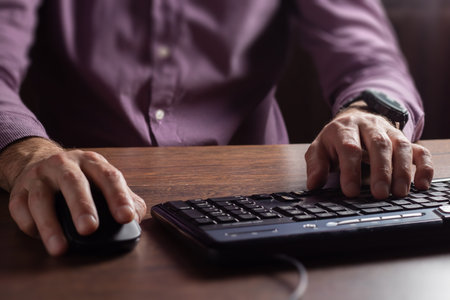 human hand on computer mouse. Business, education, people and technology concept.