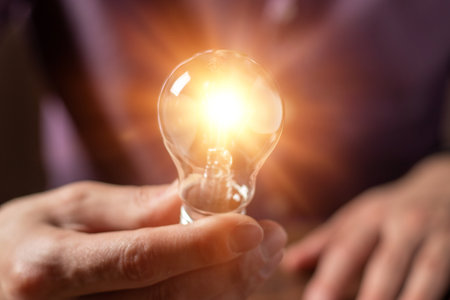 Hand holding light bulb. idea concept with innovation and inspiration.の写真素材