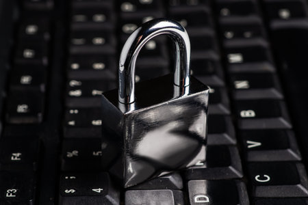 Computer security concept with a closed padlock on the keyboard.