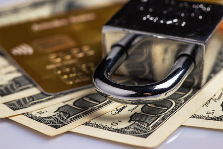 Padlock and credit card on money. Payment security concept using a bank card.の写真素材
