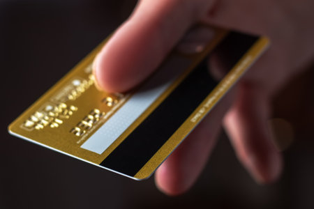 Man hand with credit card for pay close up.の写真素材