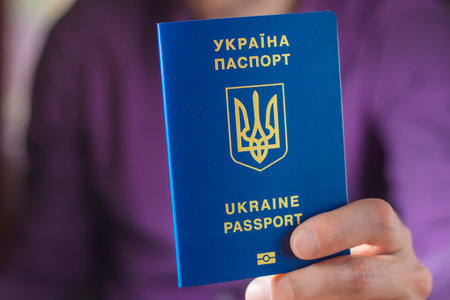 New ukrainian blue biometric passport with identification chip in hands.の写真素材