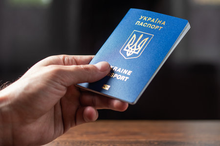 New ukrainian blue biometric passport with identification chip in hands.の写真素材