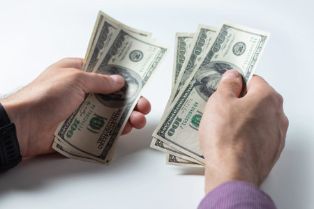 Close up male hand Counting money us dollar. financial business concept
