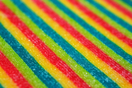 Background of rainbow sour jelly candies strips in sugar sprinkle. top view, copy space,の写真素材