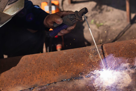 Welder erecting technical steel. Industrial steel welder in factory technical,