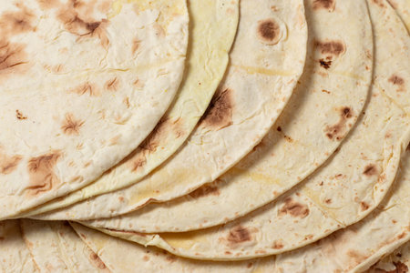 Close up of yellow corn taco shell. texture.