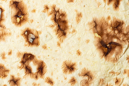 Close up of yellow corn taco shell. texture.