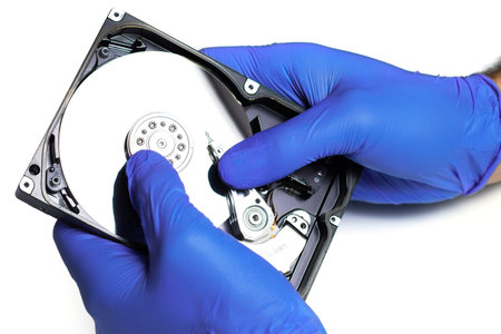 Repair hard drive. Hands of master in gloves repair the computer hard drive. Data cleaning, HDD...