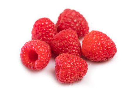 Bunch of raspberry fruits isolated on white background.