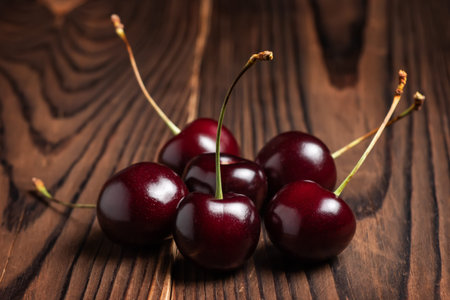 Fresh sweet cherry fruit on wooden background.