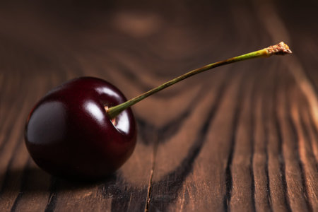 Fresh sweet cherry fruit on wooden background.