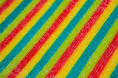 Background of rainbow sour jelly candies strips in sugar sprinkle. top view, copy space,の写真素材