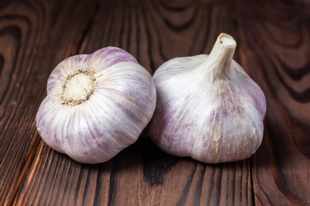 Garlic bulb on wooden background close up.の写真素材