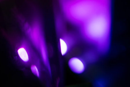 Blurred Light painting one exposure in camera. light glares with a spectral gradient on a dark background. Multicolored abstract colorful line. Unusual light effect.の写真素材