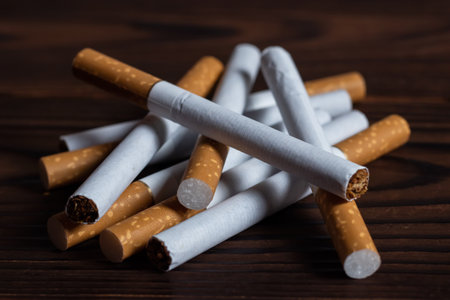 Close up of a hope smoking cigarettes. Cigarette filter tubes.の写真素材