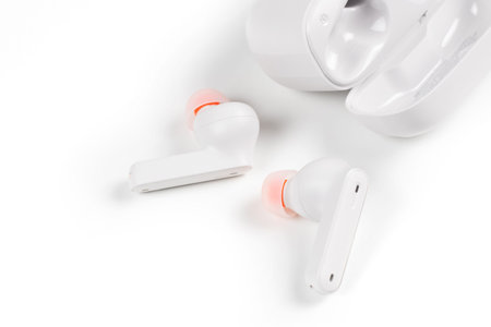 White headphones wireless earphones with case, copy space white background