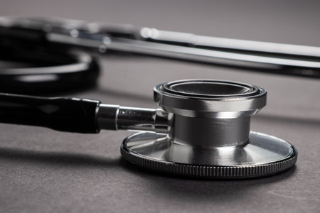 Black stethoscope on dark background. Healthcare copceptの写真素材
