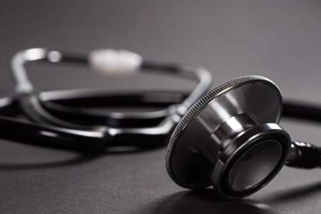 Stethoscope on black background with space for text - health concept. Medical conceptual.の写真素材