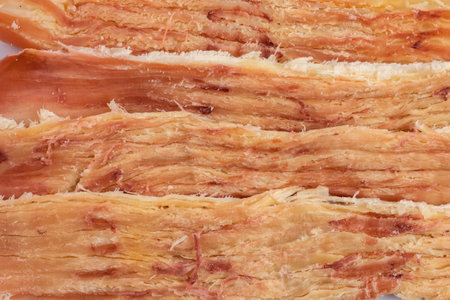 Pieces of peruvian squid close up background. snack for beerの写真素材