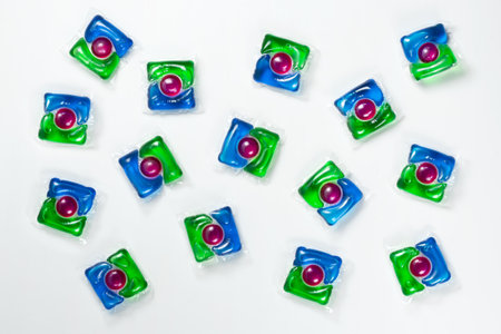 Liquid powder in gel capsule for washing multicolor isolated on the white background,の写真素材