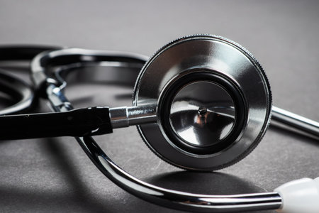 Stethoscope medical instrument on dark background close up.の写真素材