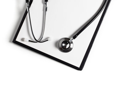 Blank clipboard with stethoscope on white background.の写真素材
