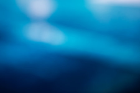 Blurred, out of focus photo, night neons bokeh, vivid blue and purple colors, cyberpunk atmosphere. Amazing wallpaper backdrop. Night city street.の写真素材