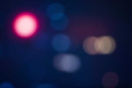 blurred bokeh background with warm colorful lightsの写真素材