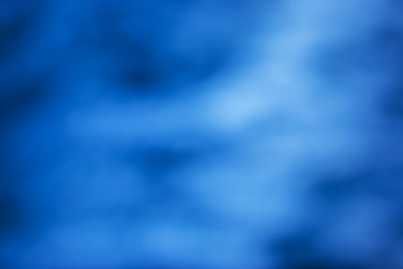 Blurred, out of focus photo, night neons bokeh, vivid blue and purple colors, cyberpunk atmosphere. Amazing wallpaper backdrop. Night city street.の写真素材