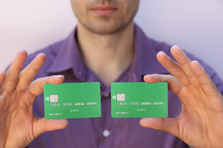 man holding credit cards close upの写真素材