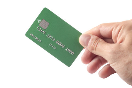 Male hand with credit card on white background.の写真素材
