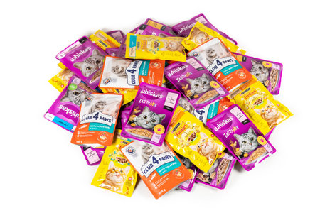 Cat food. Friskies. Whiskas. Club 4 Paws. cat food in a packs. Dnipro, Ukraine - August 04, 2023.のeditorial素材
