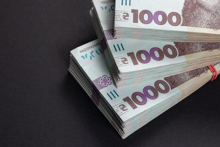 a pack of hryvnias on the table. Financial concept. Ukrainian money. 1000 hryvnia on dark background