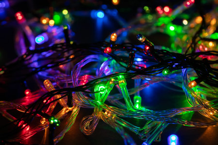 Christmas background with lights and free text space. christmas lights border. Glowing colorful...