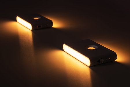 Modern wall lamps is lighting on the dark wall. backlit, night decorative lamp.