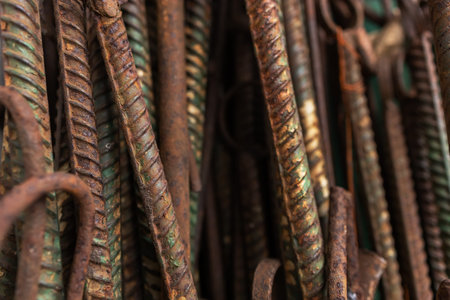 Fittings for construction. Shot of steel rods or bars used to reinforce concrete for construction. Stack of construction armature. Element of the constructional structure. Rusty fittingsの写真素材