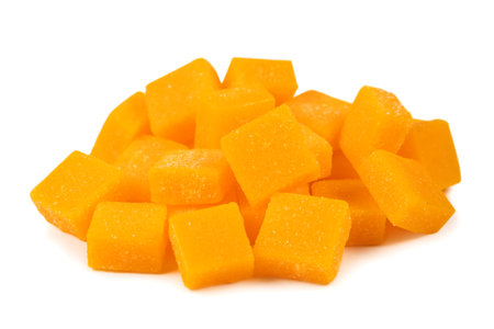 view of candied mango dices isolated on white.の写真素材